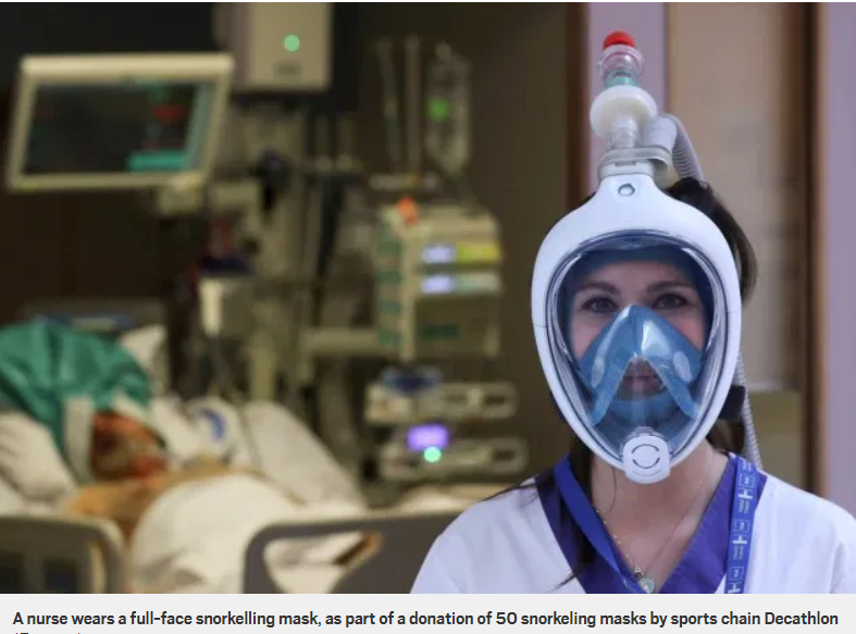 A nurse wears a full-face snorkelling mask that has been adapted by an Italian firm to make a ventilator using parts made on a 3D printer in the UK.